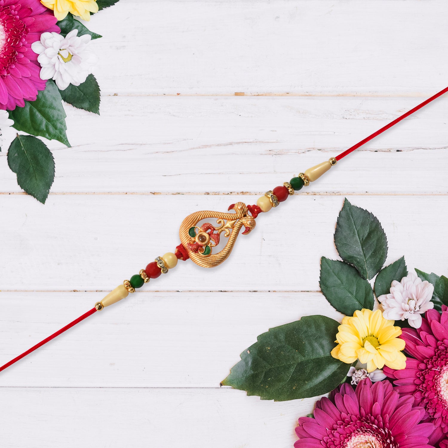 Designer Rakhi With Veena And Flower Charm Designer Rakhi With Veena And Flower Charm